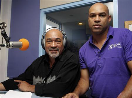 Former Surinamese dictator Desi Bouterse (L), head of the country's opposition National Democratic Party (NDP), poses with his son Dino, convicted and sentenced to jail in 2005 for smuggling of drugs and automobiles and released on parole in 2008, while participating in the local popular radio show ''90 seconds'' at Radio 10 in Paramaribo, May 22, 2010. REUTERS/Ranu Abhelakh